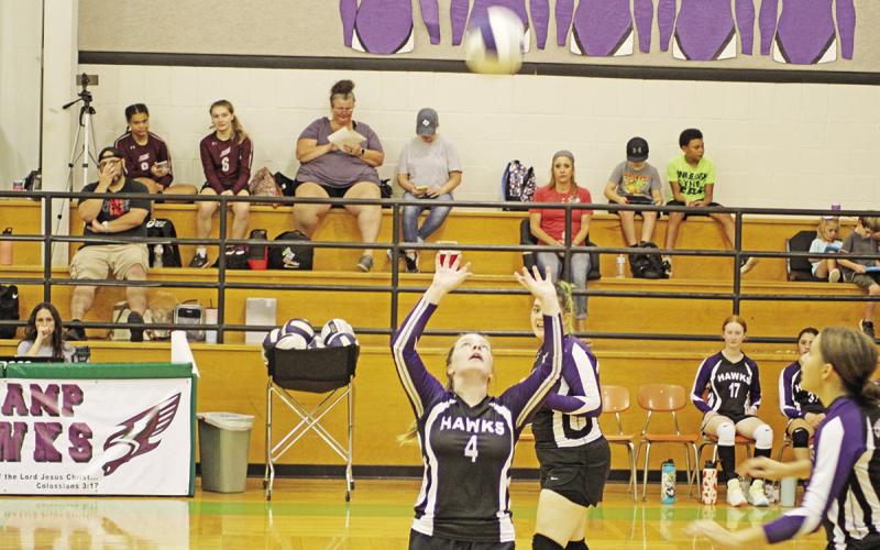 CHAAMP’s Tymber Reust prepares to set the ball while Emma Anderson (back) and Marie Glanzer (front) advance toward the net. The Lady Hawks went 2-2 in their last four games with wins over Tyler King’s Academy and Tyler HEAT. TRIBUNE PHOTO / QUINTEN BOYD