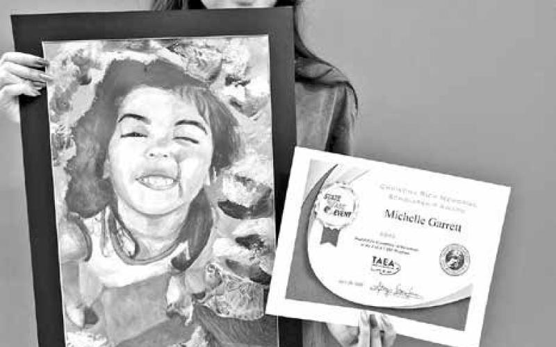 Michelle Garrett and her Christina Rich Memorial Scholarship Award for her piece “Summertime Turtle” COURTESY PHOTOS