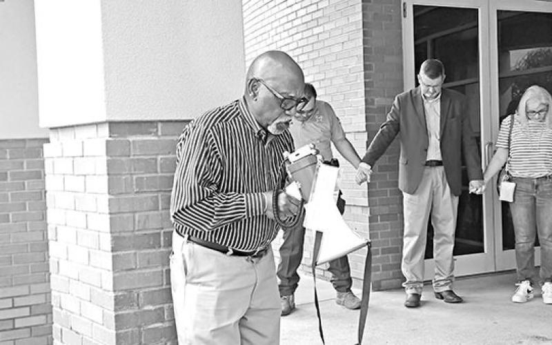Dozens join hands at Mount Pleasant City Hall on Prayer Day