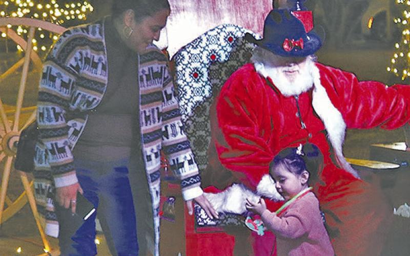 Cowboy Santa was a favorite for the little ones Thursday night downtown. COURTESY PHOTOS / SARAH STENCE