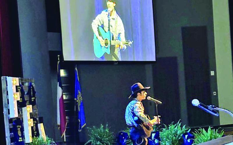 Christo Escalante performs for the members