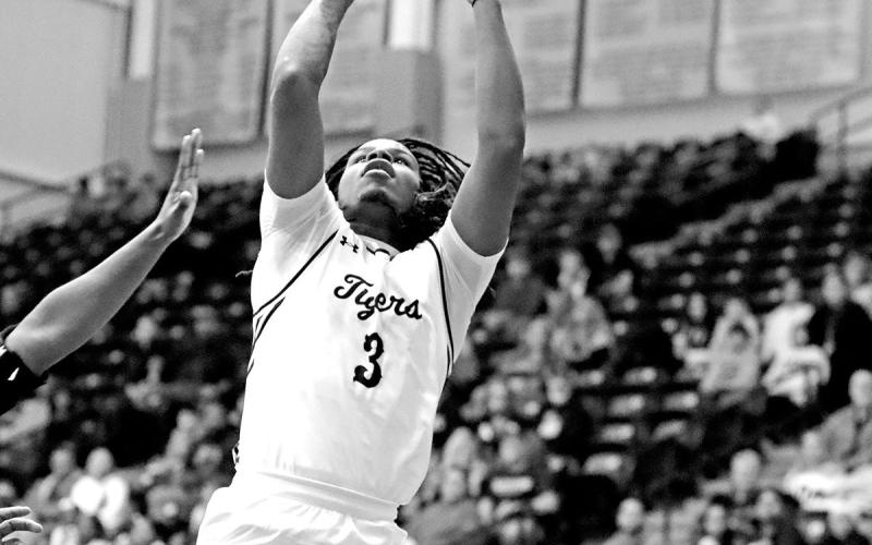 Ashad Smith beats Texas High defenders to the basket and scores as Mt. Pleasant rolls through Texas High.