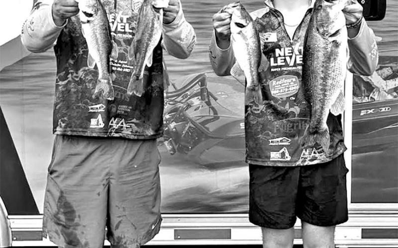 State qualifier Logan Holderness (right) and Boat Captain Danny Holderness