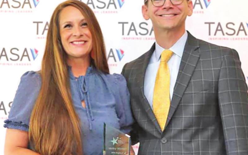 Shelley Bloomer stands proudly with Commissioner Morath of TASA after receiving her award at the 2021 TASA/TASB Convention. COURTESY PHOTO