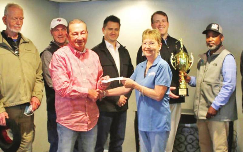 Shown is the presentation of the Mayor’s Cup trophy and proceeds check after the 2020 competition. TRIBUNE PHOTO / DI DUNCAN