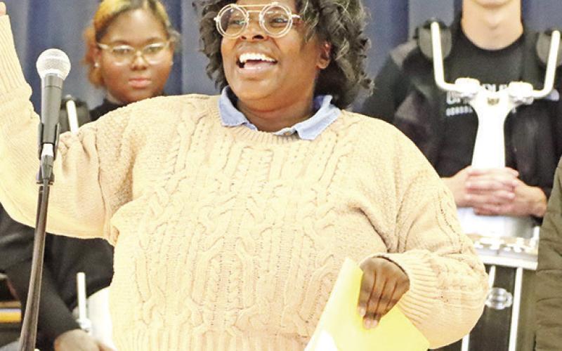 Nakeisha Gardner (left) from Frances Corprew Elementary School celebrates receiving her $599.00 grant from Foundation member Ester Smith.
