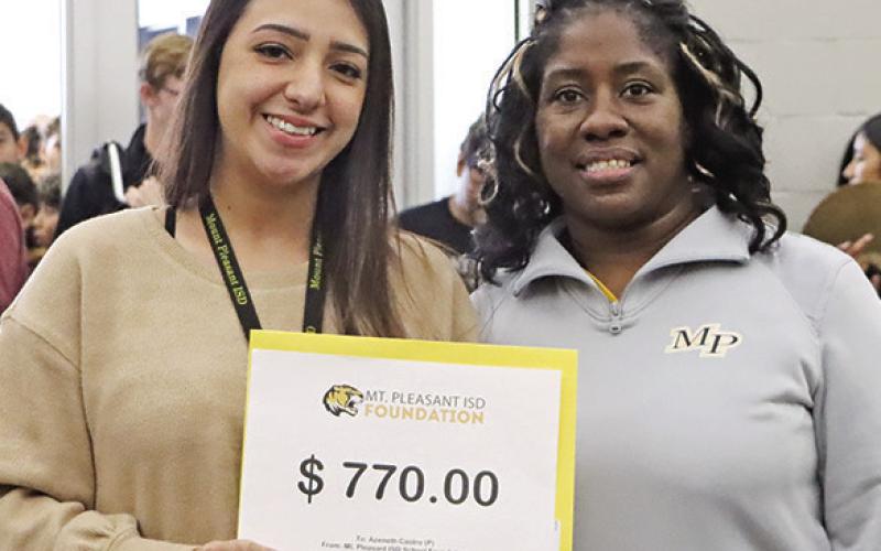 Azeneth Castro (left) from MPJH with her $770 grant for an outdoor gazebo and picnic table, presented by Foundation member, Crystal Jackson.