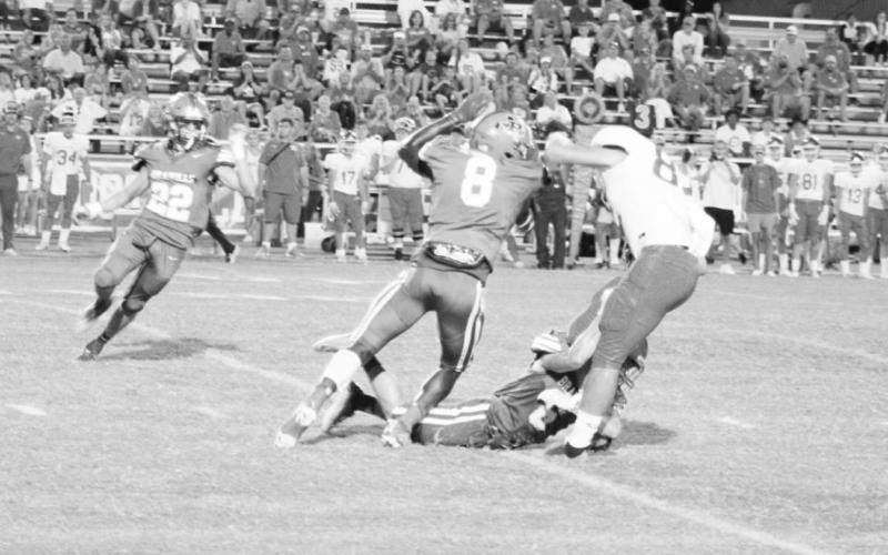 Pewitt’s Deiontray Hill delivers a hit to a Celina receiver as Jack Morris assists on the stop. The Brahmas will take on Hooks to open district play Friday. TRIBUNE PHOTO / QUINTEN BOYD