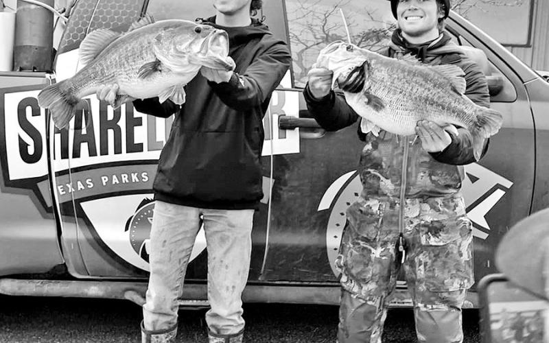 Dalton Smith (left) and Caden Cowan with their two Legacy Lunkers weighed just minutes apart on February 2 at Lake O.H. Ivie. Both anglers used forward-facing sonar to locate and catch their fish. It’s Smith’s third FFS 14 pounder since December 30. (TPWD Photo)