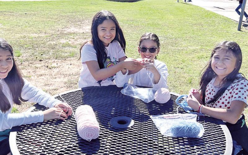 (L to R) Mallory Mancera, Josie Rodriguez, Yamilex Rodriguez, and Valerie Aguilar work on their projects during lunch