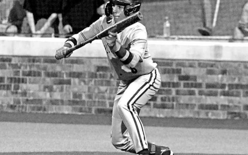 Mount Pleasant lead-off hitter Daxton Price (6) squares around to bunt against Texas High on Monday night in Atlanta.