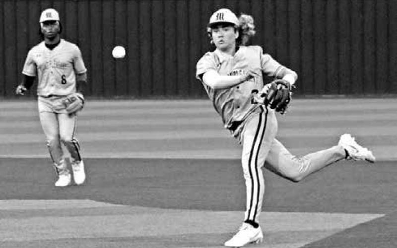 Mount Pleasant Tiger second baseman Christian Johnson (2) makes a throw to first base during Monday night’s 8-6 win over Texas High.