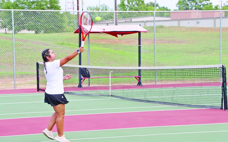 Galilea Torres smashes an overhead winner in her singles match against Marshall COURTESY PHOTO / HUNTER MCGEE
