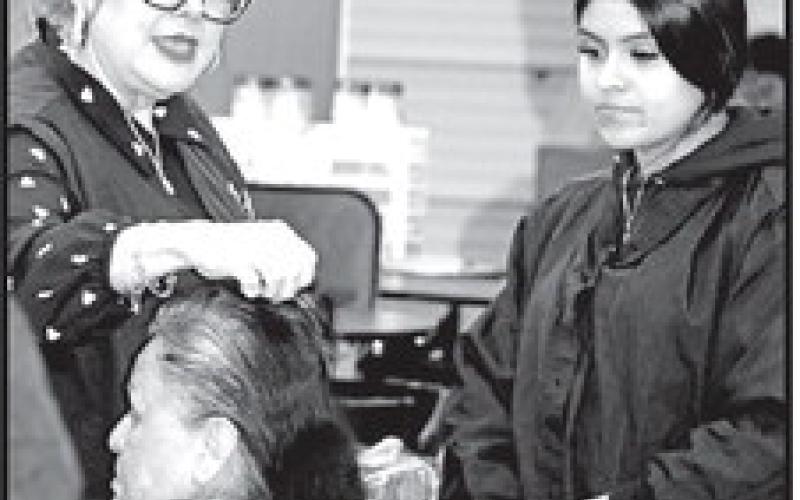 Cosmetology instructor, Aleshia Rivera (left), consults with student, Lesly Canada COURTESY PHOTOS