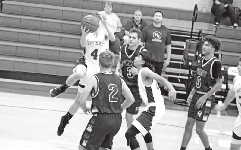 Ashyr Carrington splits the Cumby defense for a layup in Tuesday afternoon’s game. Harts Bluff’s JV 1 team defeated the Trojan varsity, 57-49. TRIBUNE PHOTO / QUINTEN BOYD