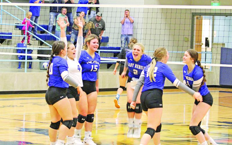 The Lady Rebels celebrate following match point of their bi-district round matchup against Linden-Kildare Tuesday. From left are Stoney Carey, Logan Huddleston, Elizabeth Langehennig, Vivian Hines, Anna Duvall and Emma Johnson.