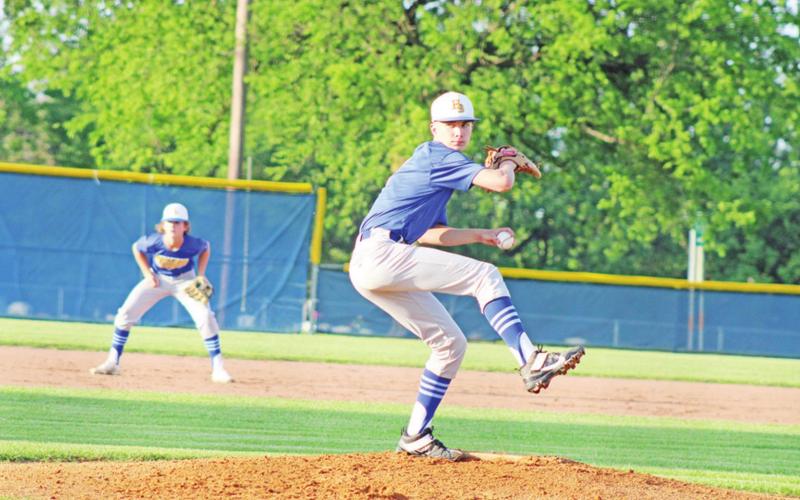 Harts Bluff’s Cohen Williams prepares a pitch during Friday’s game at Sulphur Bluff. The Bulldogs will officially play in their first UIL district next year. TRIBUNE PHOTO / QUINTEN BOYD