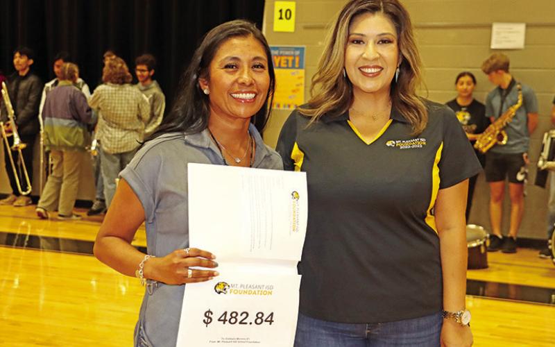 Wallace teacher, Estibaliz Moreno (left), receives a grant from Foundation Vice President for Events/Marketing, Ester Smith, for P.E. equipment