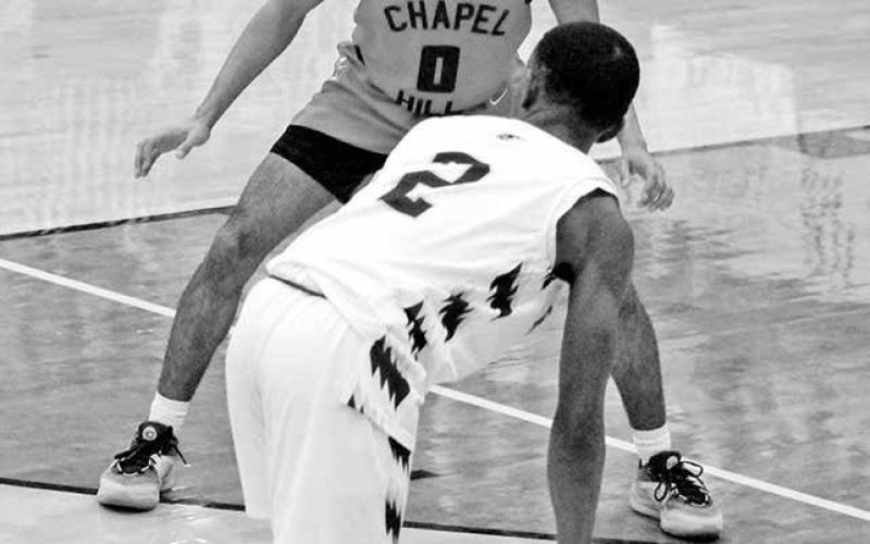 Chapel Hill’s Jaydyn Haley defends New Boston’s Adrian Myrks during the bi-district round. The fourth-ranked Red Devils took on fifth-ranked Hooks Tuesday for the chance to play at this weekend’s regional tournament, TRIBUNE PHOTO / QUINTEN BOYD