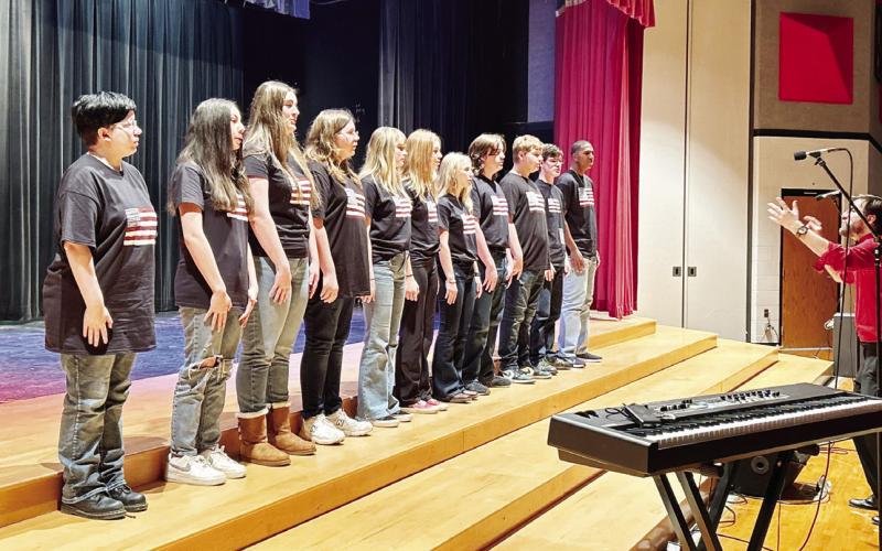 TRIBUNE PHOTOS / MIRANDA OGLESBY Local schools hosted Veterans Day programs Friday, honoring those who served. (Above) It was a full house during Chapel Hill ISD’s program. (Left) Chapel Hill High School choir performs for the crowd.