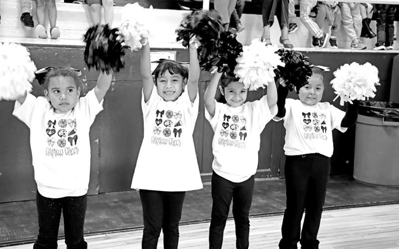 Members of Corprew Tiny Cheer help hype up the crowd