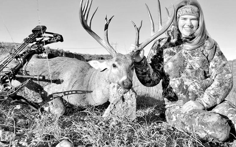 Lady archer Hailey Holder with the 7 1/2-year old buck she arrowed in Collingsworth County in the Texas Panhandle on October 14. Holder reported on the Texas Buck Registry that hunters had purposely avoided shooting the deer for the last four seasons to allow it to mature. COURTESY PHOTO / TEXAS BUCK REGISTRY