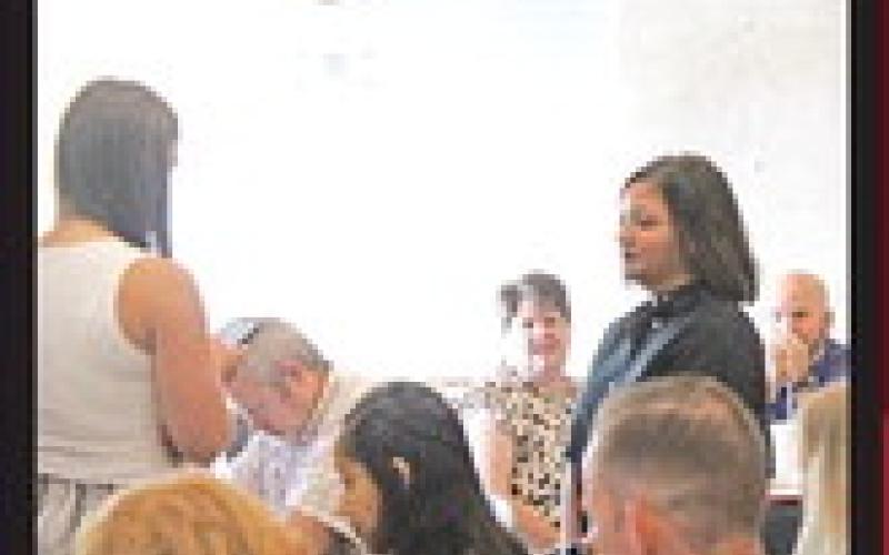 Katie Hart giving her speech about her special guest Mrs. Michelle Windham.