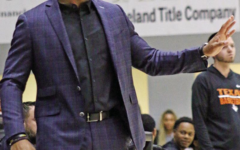 Mount Pleasant Head Coach Joey Chism gives instruction to his team during Friday night’s win over visiting Texas High. TRIBUNE PHOTOS / MICHAEL S. MCCRACKEN