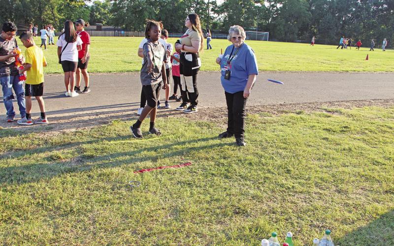 A Wallace student tries to win a 2 liter drink