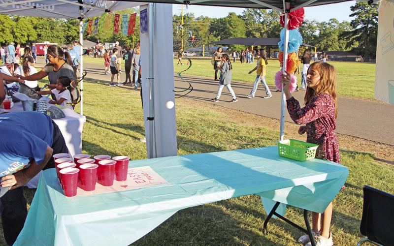 A Wallace student plays cup toss for prize COURTESY PHOTO