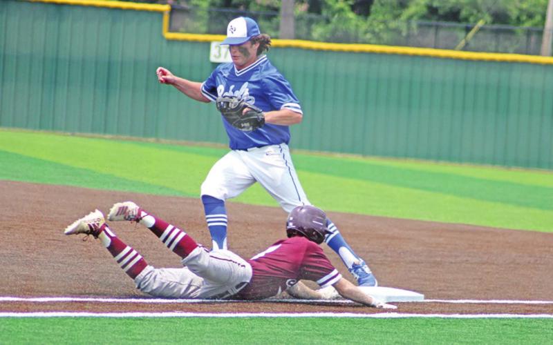 Rivercrest’s Ethan Taylor beats Maud’s Nate Brower to first for the first out of the final inning of game three Saturday. TRIBUNE PHOTOS / QUINTEN BOYD