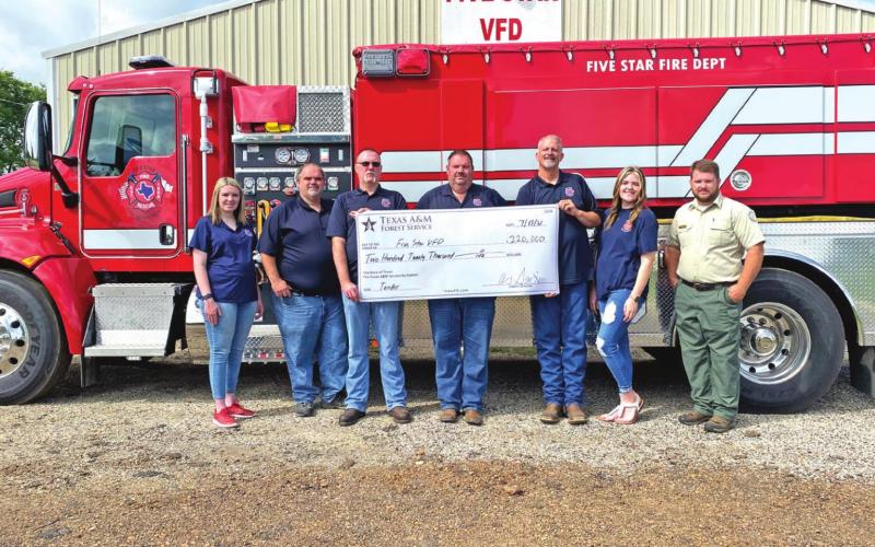 Firefighters Amanda Phillips and Kenneth Williams, Chief Lee Alsup, Captain Marc Williams, Training Officer Garrett Gunn, Firefighter Jessica Williams and Texas A&amp;amp;M Forest Service Regional Fire Coordinator Cody Mayo. COURTESY PHOTO