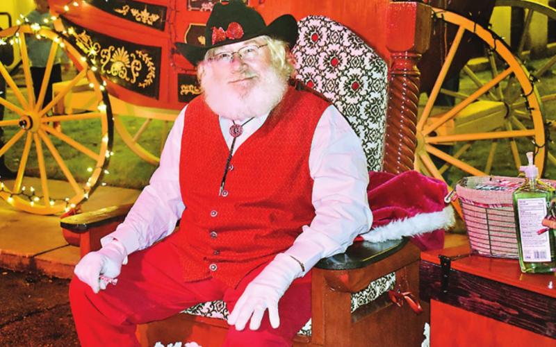 Cowboy Santa sits near the courthouse. COURTESY PHOTO