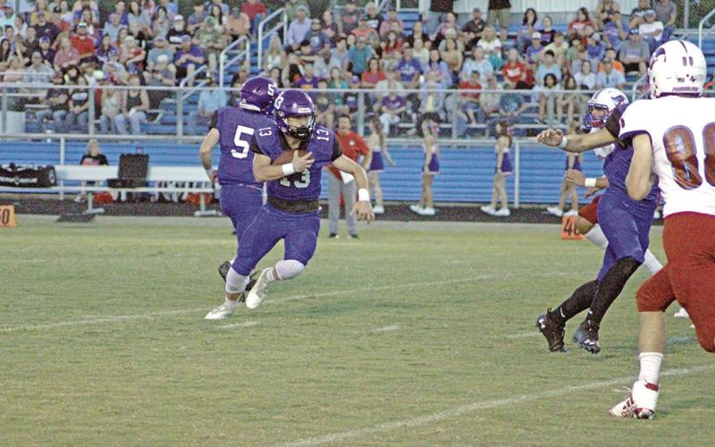 Rivercrest’s Zane Dees turns upfield after taking a handoff during a recent game. Dees ran for 80 yards and two touchdowns, had 25 yards receiving and finished with seven tackles and an interception. The Rebels picked off three passes on the night in the 22-20 win. TRIBUNE PHOTO / QUINTEN BOYD