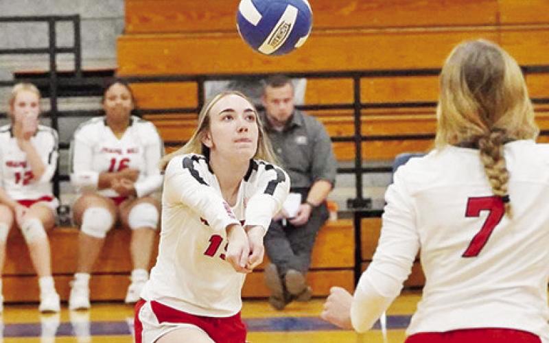 Chapel Hill’s Keira Hawkins bumps as teammates back her up. The Lady Devils defeated Ore City and Clarksville in their last two matches and opened district against Quitman Friday. COURTESY PHOTO