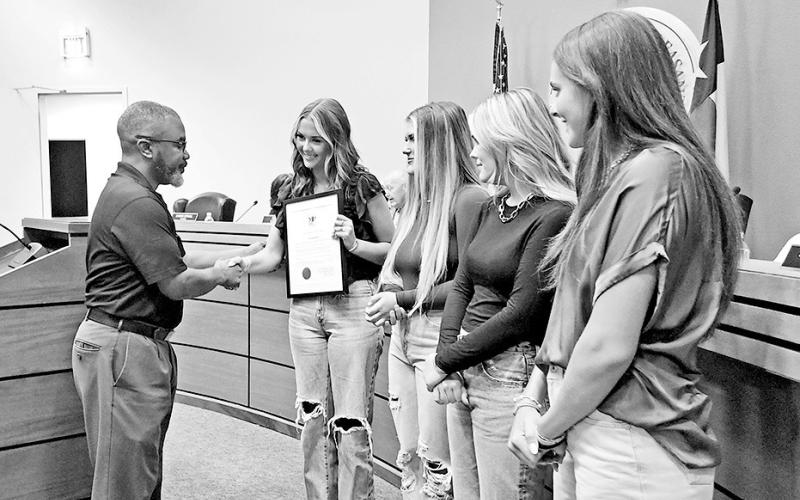 Mayor Tracy Craig shakes hands with the young women who took life-saving actions on June 7 TRIBUNE PHOTOS / NICOLE KIMBALL