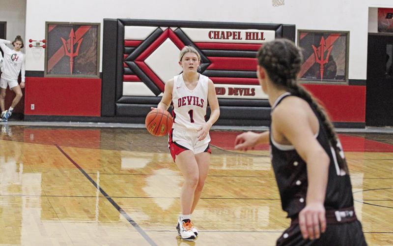 Chapel Hill’s Kaylee Tompkins brings the ball upcourt during Saturday’s home opener against Martins Mill.