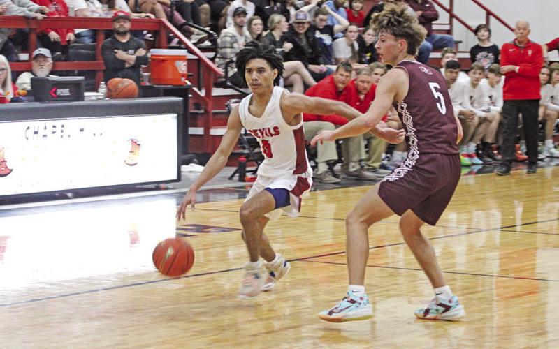 Jaydyn Haley drives to the basket during Saturday’s game against Martins Mill. TRIBUNE PHOTOS / QUINTEN BOYD