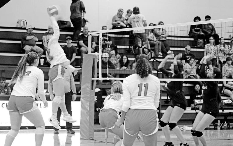 Kaylee Tompkins jumps for a spike during Tuesday’s game against Winona. The Lady Devils evened their district record at 2-2 with a 3-0 win over the Lady Cats. TRIBUNE PHOTO / QUINTEN BOYD
