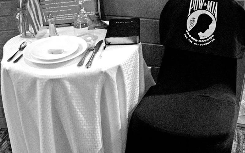 Table set in honor of POW/MIA.