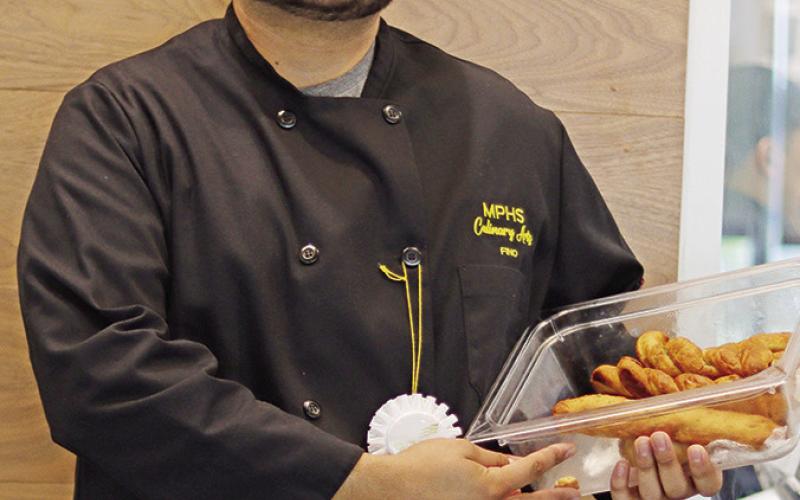 Delfino Hernandez and his state award winning Garlic and Herb Bread and Breadsticks COURTESY PHOTO