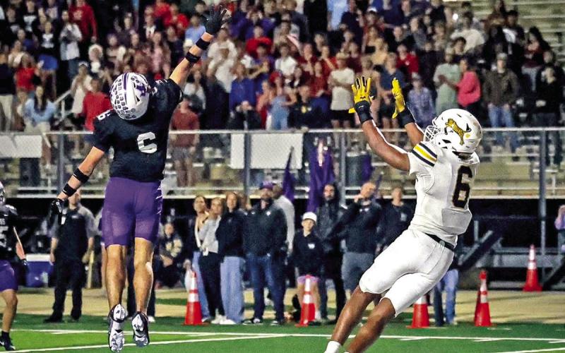 Emmanuel Harris leaps towards Cook’s pass and secures the win for Mt. Pleasant with 13 seconds left in the 4th quarter. Photo courtesy of Senior Photography Student-Andres Jaimes