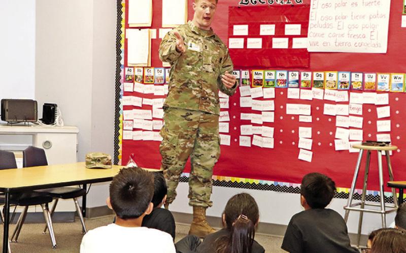SFC Trevor Meek speaks to students about jobs available in the US Army