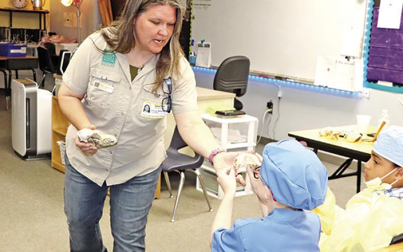 Penny Wilkerson with Texas Parks and Wildlife shows students some of the animals found in the wild