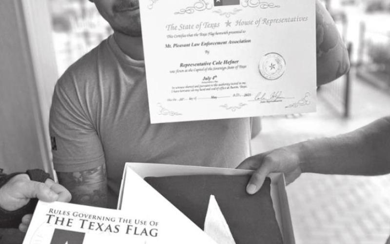 MPLEA receives Texas Flag from Cole Hefner