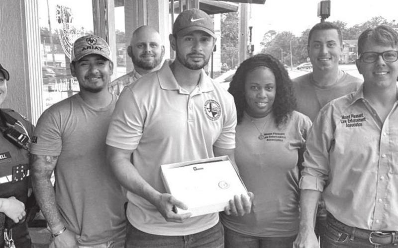 MPLEA receives Texas Flag from Cole Hefner