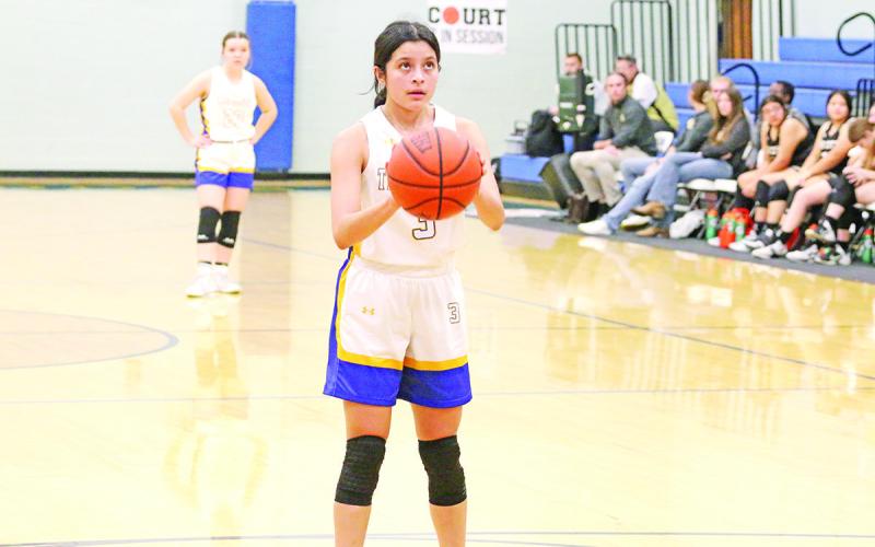 Alexa Arzate prepares to shoot a free throw during the Lady Bulldogs’ game against Ore City last week. The Lady Bulldogs dropped their two games last week, falling to the Lady Rebels and Avinger.