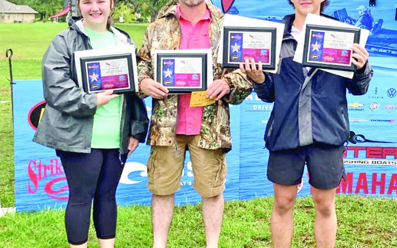 Khloe Dunn (left), Boat Captain James Dunn (center), and Kamen Dunn (right) with their Tournament Champion and Big Bass awards