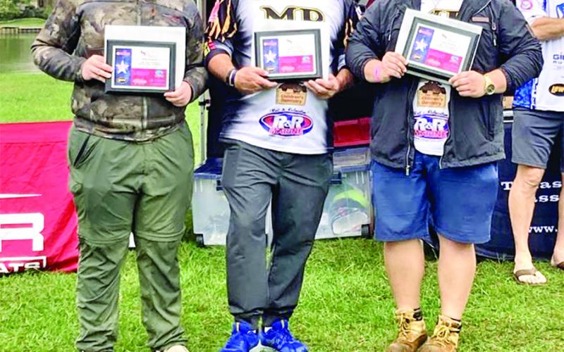 Rolston Morton (left), Boat Captain Randy Hinton (center), and Clayton Miller (right) with their 4th place plaques