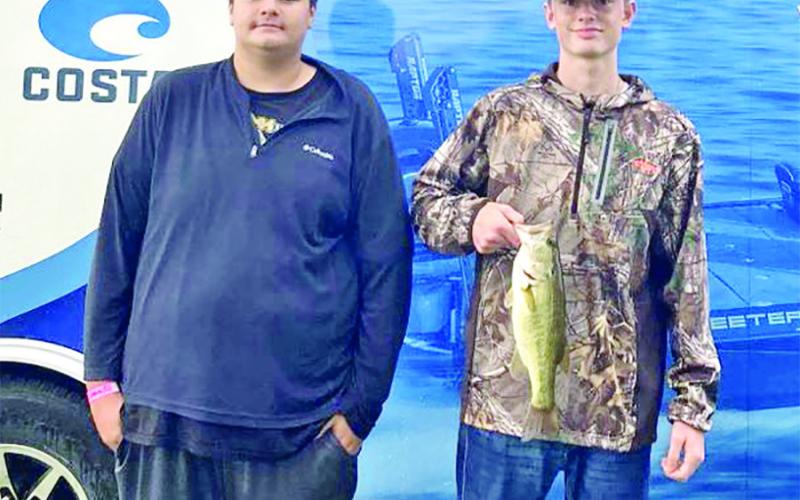 Donald Cole (left) and Blake Humber show off their catch COURTESY PHOTOS
